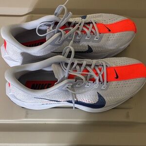 Nike White Running Shoes with Bright Orange Stripe and Navy Swoosh